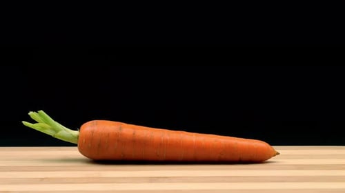Carrot Chopped into Cubes on a Cutting Board
