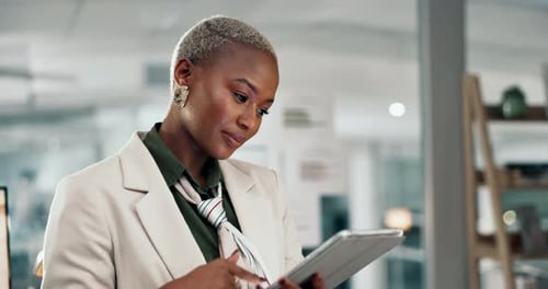 Business, black woman and typing on tablet in office at night for email feedback