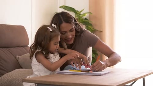 Mother and Child Drawing Together at Home