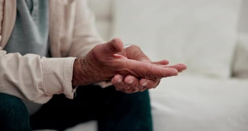 Massage fingers, pain and arthritis, sick or disease in home living room closeup