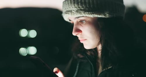 Woman, phone and scrolling at night in city for communication, social media or outdoor networking
