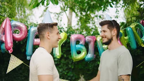 Young Men Celebrate a Birthday Party Together