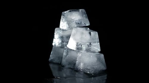 Cool Ice Cube Pyramid Rotating on Black Surface