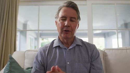 Adult Man Talking on Video Call at Home