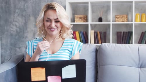 Young and Attractive Woman Works at Home Using Laptop Computer Freelancer or Student Has Online