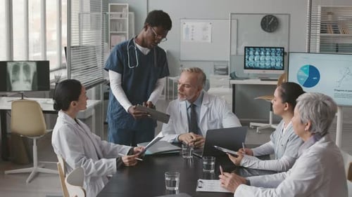 Medical Team Meeting in Bright Office