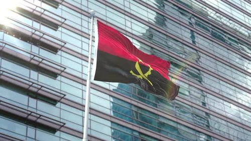 Realistic Waving Angola Flag on Modern Corporate Building
