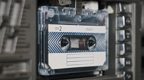 Insert an Audio Cassette in a Tape Recorder and Playback Eject CloseUp