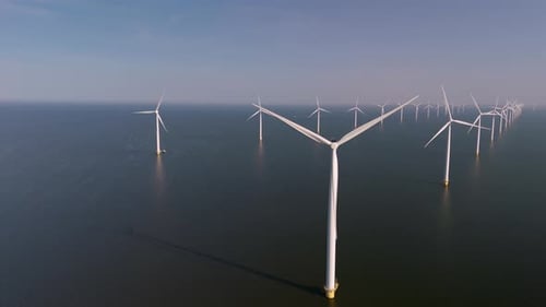 Exploring the Majestic Wind Turbines of the Netherlands on a Clear Day
