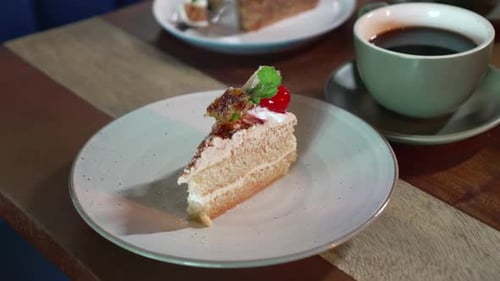 Slice of Cake with Coffee Cup on Table