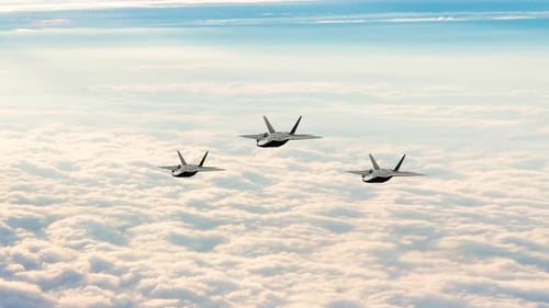 Modern Fighter Jets Flying in Formation Above Clouds