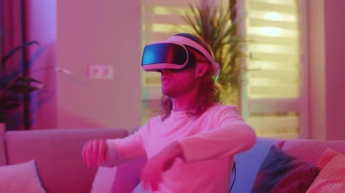 Young Adult Immersed in Virtual Reality at Home