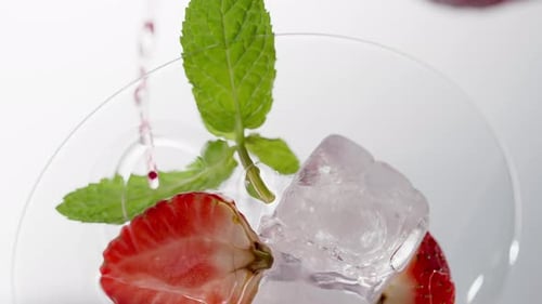 Refreshing Summer Drink with Strawberries, Ice, and Mint