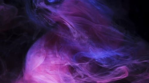 Abstract Purple and Blue Ink Clouds Against Black