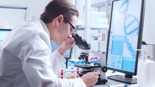 Scientist Using Microscope in Modern Lab