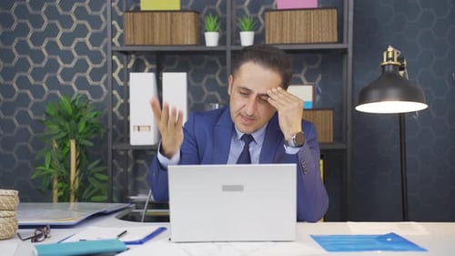 Man in Suit On Video Call in Office