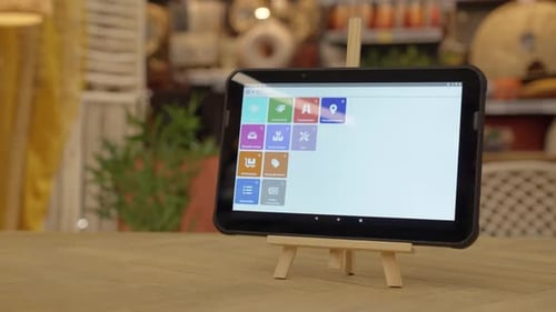 Tablet Displaying App Interface on Miniature Easel