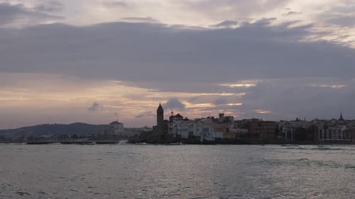 The City Skyline on Sunset Near the Water A Few Clouds on the Sky