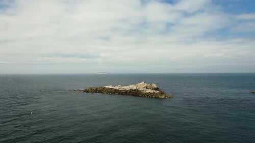 Aerial view of rocky island in the sea, Ireland.