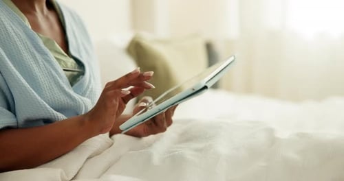 Hands, scroll and person with tablet in bedroom, entertainment and searching for ebook in apartment