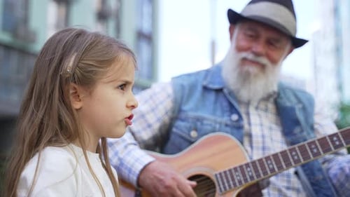 Close Up of Little Lovely Girl Singing Outdoor