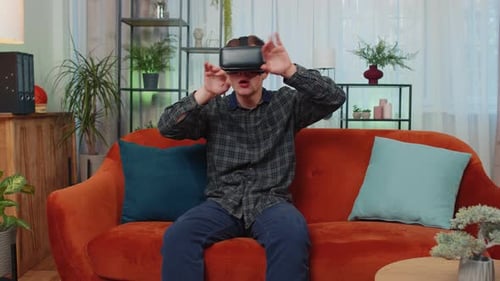 Young Adult Using VR Headset at Home