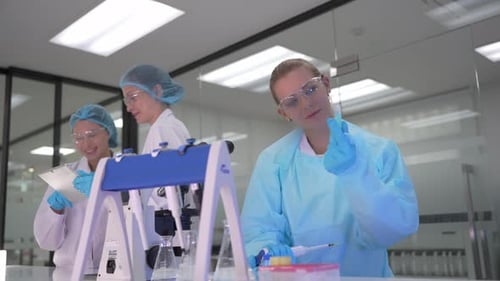 Scientists Working Diligently in Modern Laboratory Setting