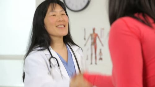 Doctor speaking with patient in medical office