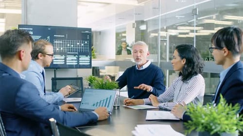 Business team in meeting discussing company growth data