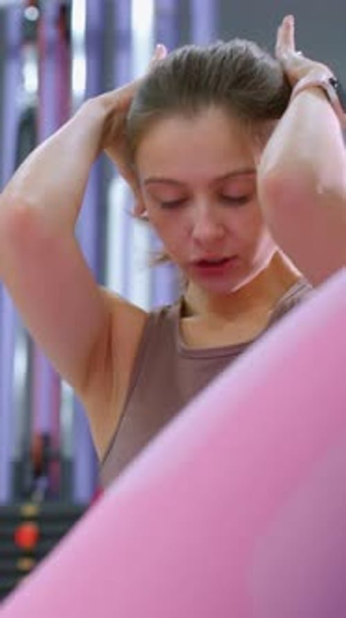 Intense Ab Workout with Instructor Guidance in Gym