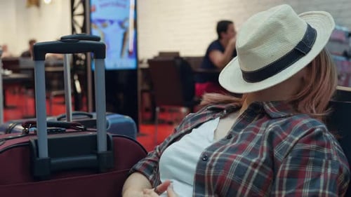 Flight Delay Cancellation Female Tourist Sleeps at Airport