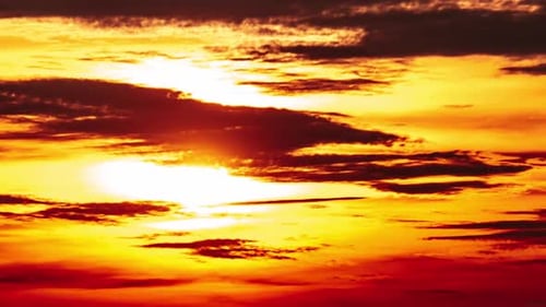 Golden Sky at Sunset with Moving Clouds