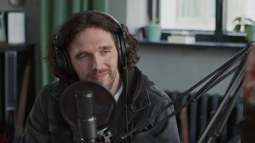 Caucasian Man Hosting Podcast Talking to Guest