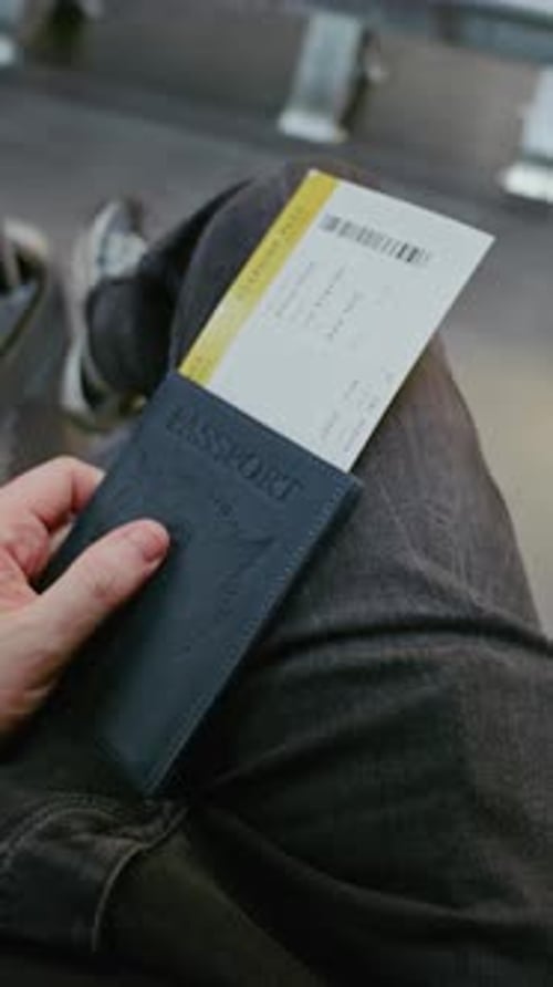 Airport Terminal Passenger with Suitcase Sitting in Departure Lounge of Airline Hub FirstPerson View