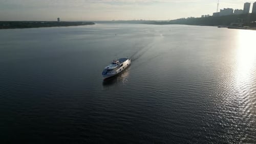Passenger Ferry Navigating River at Sunrise Clip