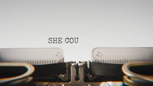 Old mechanical typewriter typing She Couldn’t Say His Name in a close-up view.