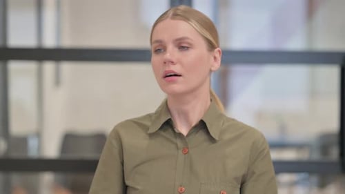 Portrait of Coughing Sick Young Woman in Office