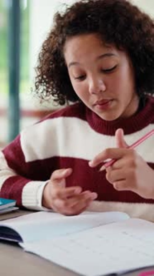 Homework, thinking and child writing with math answer for activity sheet, education and learning