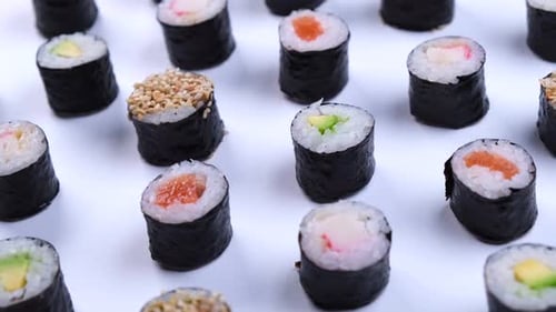 Variety of Maki Sushi Rolls on White Surface