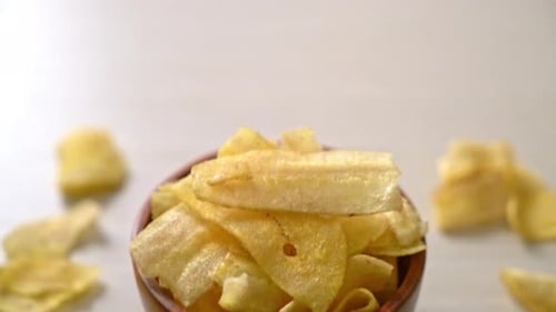 Close Up Bowl of Golden Banana Chips