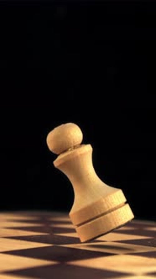 Super Slow Motion Chess Figure Falls on the Chessboard Filmed on a Highspeed Camera at 1000 Fps