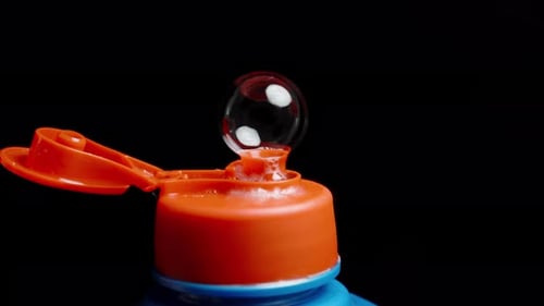Captivating Surface Tension Bubble Bursting Macro Shot