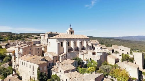 Drone Shot Church and Buildings in Gordes Town on Hilltop in Provence