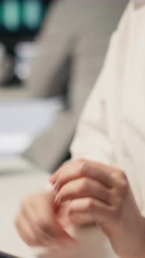 Vertical Video Software Developer Monitoring Server Clusters Performing AI Training Close Up