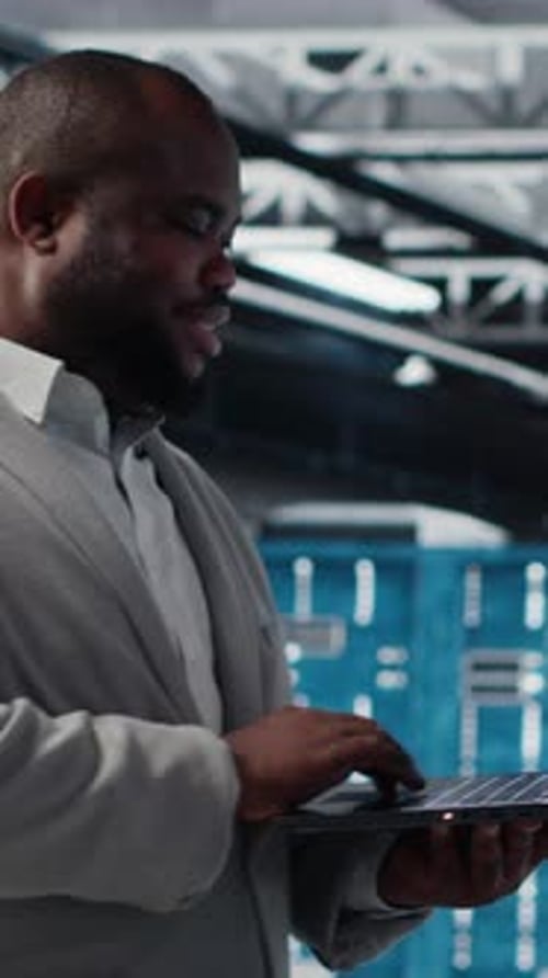 Vertical Video Data Center Software Developer Using Tablet to Do AI Algorithms Improvements