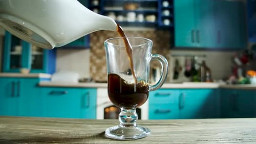 Dark Brew Coffee Pour into a Glass Mug