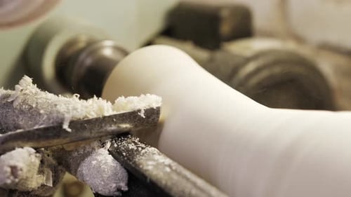Machine Shaping White Material with Metal Tool