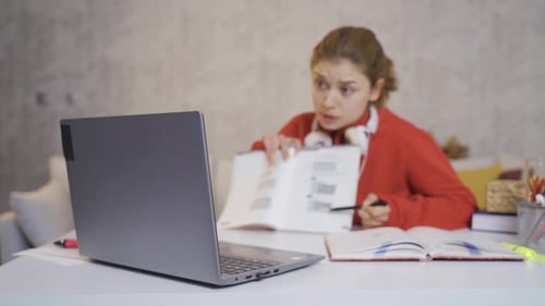 Young Adult Studying at Home With Laptop