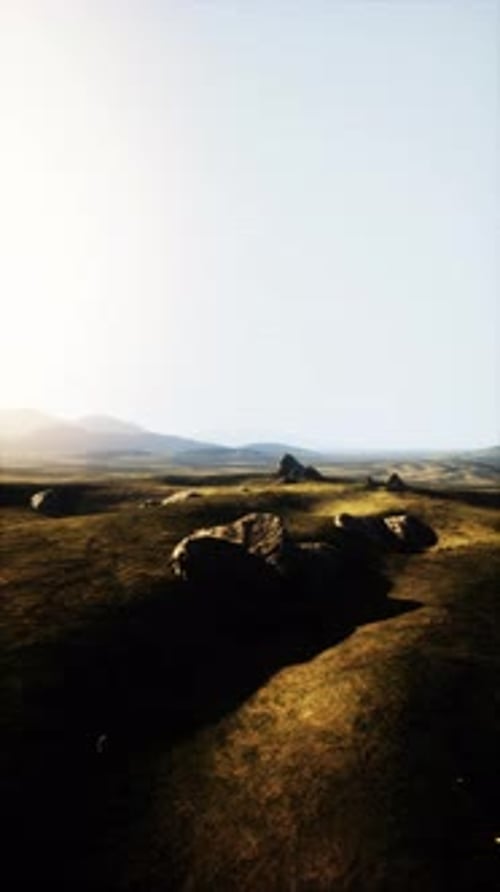 Grassy Plain With Rocks in Foreground