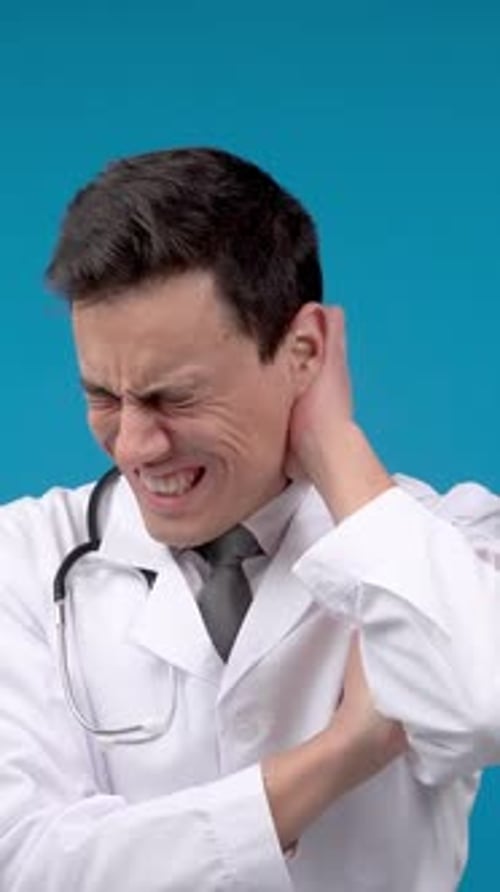 Concerned Doctor Thinking About Problems in Studio
